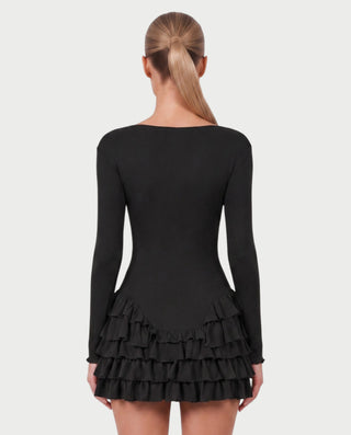 Vestido mini de malla con aberturas y detalle de cadena de JUVIA