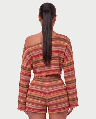 Vestido mini de malla con aberturas y detalle de cadena de JUVIA