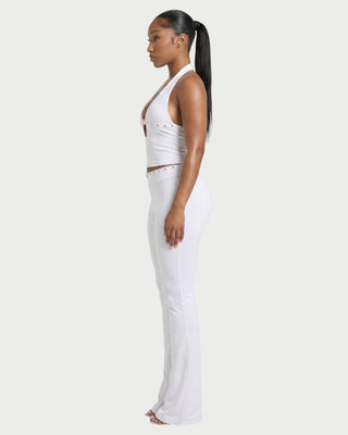 Conjunto de top con cuello halter y pantalón con tachuelas de SIANE 