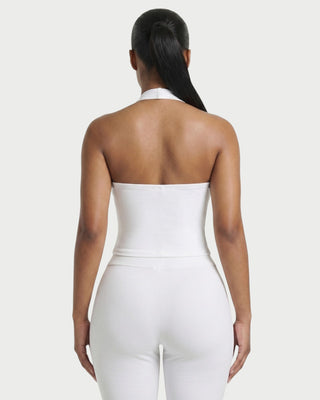 Conjunto de top con cuello halter y pantalón con tachuelas de SIANE 