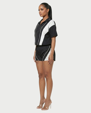Conjunto deportivo de top con cremallera y pantalones cortos en contraste LOIRA