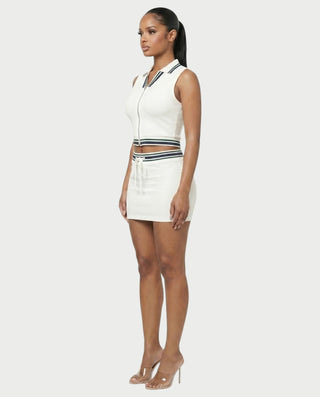Conjunto deportivo de top con cuello y minifalda con cremallera frontal DRAYA