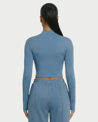 Chaleco corto con hebilla frontal de piel sintética QUELLA